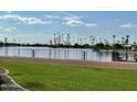 Scenic lakefront property with lush landscaping and palm trees at 10330 W Thunderbird Blvd # C115, Sun City, AZ 85351