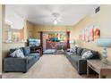 Spacious living room with sliding glass doors to patio at 14950 W Mountain View Blvd # 5101, Surprise, AZ 85374