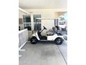 White golf cart parked in driveway at 650 N Hawes Rd # 3530, Mesa, AZ 85207