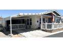 Mobile home with covered carport and patio at 650 N Hawes Rd # 3530, Mesa, AZ 85207