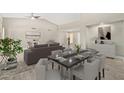 Modern dining area with dark table and grey chairs at 13447 W Ballad Dr, Sun City West, AZ 85375