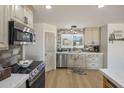 Modern kitchen with stainless steel appliances and subway tile backsplash at 1505 E Cloud Rd, Phoenix, AZ 85086