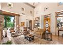 Bright living room with hardwood floors and large windows at 28080 N 101St St # 116, Scottsdale, AZ 85262