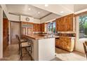 Gourmet kitchen with island, custom cabinetry and breakfast bar at 28080 N 101St St # 116, Scottsdale, AZ 85262