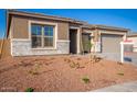 House exterior with new landscaping and two-car garage at 20230 W Hollyhock St, Buckeye, AZ 85396