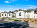 Modern home with gray roof and stone accents at 11905 N 83Rd Pl, Scottsdale, AZ 85260