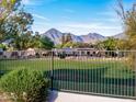 View of a golf course with mountains in the background at 11905 N 83Rd Pl, Scottsdale, AZ 85260