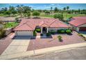 Single-story home with red tile roof and landscaped yard at 2119 N Lake Shore Dr, Casa Grande, AZ 85122