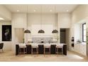 Modern kitchen with large island and high ceilings at 0 N Marchant Trace --, Queen Creek, AZ 85144