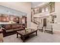 Spacious living room with high ceilings and a view into the kitchen at 3314 E Azalea Dr, Gilbert, AZ 85298