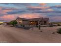 Desert home exterior at sunset with mature landscaping at 39730 N New River Rd, Phoenix, AZ 85086