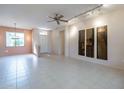 Bright and spacious living room with tile flooring and neutral walls at 20419 N Shadow Mountain Dr, Surprise, AZ 85374