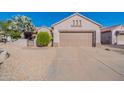Single-story home with a two-car garage and desert landscaping at 20419 N Shadow Mountain Dr, Surprise, AZ 85374