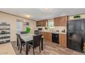 Modern kitchen with dark wood cabinets and black appliances at 320 E Mckellips Rd # 237, Mesa, AZ 85201