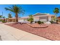 Single story home with a landscaped front yard at 12406 W Cougar Dr, Sun City West, AZ 85375