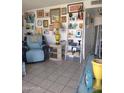 Living room with tiled floors and gallery wall at 9627 W North Ln # B, Peoria, AZ 85345