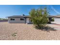 Ranch style home with a covered entry and well-maintained landscaping at 2024 N Miller Rd, Scottsdale, AZ 85257