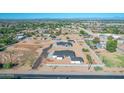 Aerial view of a neighborhood with two new houses under construction and surrounding homes at 26761 S 181St Pl, Queen Creek, AZ 85142