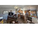 Open kitchen with wooden cabinets and an island at 650 N Hawes Rd # 4507, Mesa, AZ 85207