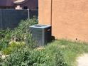 New AC unit in the backyard at 46157 W Holly Dr, Maricopa, AZ 85139