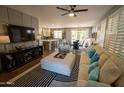 Spacious living room with open floor plan and a view of the kitchen and dining area at 41417 N Clear Crossing Rd, Anthem, AZ 85086