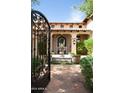 Inviting courtyard with a central fountain and lush landscaping at 10728 E Cottontail Ln, Scottsdale, AZ 85255
