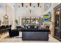 Spacious living room with fireplace and high ceilings at 9926 E Kemper Way, Scottsdale, AZ 85255
