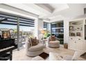 Comfortable living area with large windows, city views, and plush seating at 7117 E Rancho Vista Dr # 4011, Scottsdale, AZ 85251