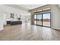 Open kitchen with an island and modern appliances at 19003 W Lawrence Rd, Waddell, AZ 85355