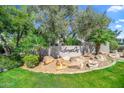 Landscaped entrance to Sunset Cove community at 7700 E Gainey Ranch Rd # 103, Scottsdale, AZ 85258