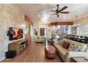 Open living room with views into kitchen and dining area at 886 W St Andrews Dr, Casa Grande, AZ 85122