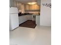 Kitchen with white cabinets, and a patterned area rug at 535 S Alma School Rd # 37, Mesa, AZ 85210