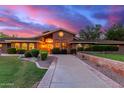 Brick home with a welcoming front entrance and landscaping at 1020 E Caroline Ln, Tempe, AZ 85284