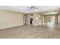 Open living room with kitchen and backyard access at 30200 N Desert Willow Blvd, San Tan Valley, AZ 85143