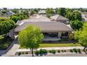 Single story home with a large backyard and patio at 1920 E Schooner Ct, Gilbert, AZ 85234