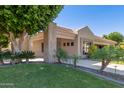 Single-story home with landscaped yard and covered entryway at 1920 E Schooner Ct, Gilbert, AZ 85234