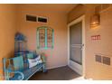 Inviting entryway with a bench, wall decor, and a security screen door at 11500 E Cochise Dr # 2011, Scottsdale, AZ 85259
