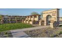 Entrance to the Escalante community with stone pillars at 16214 W Questa Dr, Surprise, AZ 85387