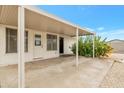 Covered patio with access to backyard at 9901 W Desert Forest Cir, Sun City, AZ 85351