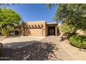 Beautiful stucco home with a paved driveway at 6964 E Redbird Rd, Scottsdale, AZ 85266