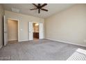 Spacious bedroom with carpet flooring and ensuite bathroom access at 21853 N 261St Ave, Buckeye, AZ 85396