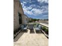 Inviting patio featuring a fire pit and comfortable seating at 5755 S Joshua Tree Ln, Gilbert, AZ 85298