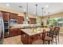 Gourmet kitchen boasts granite countertops and ample cabinetry at 20371 E Calle De Flores --, Queen Creek, AZ 85142