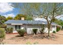 White single-story home with a teal roof and attached garage at 805 N Robson --, Mesa, AZ 85201