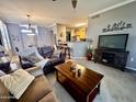 Spacious living room featuring a comfortable couch and large TV at 20100 N 78Th Pl # 3090, Scottsdale, AZ 85255