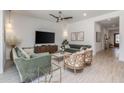 Living room with green velvet sofas and wood accents at 20955 E Mayberry Rd, Queen Creek, AZ 85142