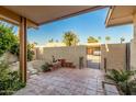 Small backyard with a gate and gravel pathway at 4525 N 66Th St # 70, Scottsdale, AZ 85251