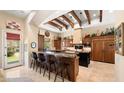 Bright kitchen boasts granite countertops, custom cabinetry, and breakfast bar at 4536 N Arcadia Dr, Phoenix, AZ 85018