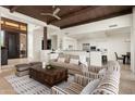 Spacious living room with a cozy sitting area and a view of the kitchen at 9975 E Broken Spur Dr, Scottsdale, AZ 85262
