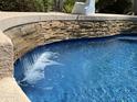 Close-up of a pool's waterfall feature at 2055 S Marble St, Gilbert, AZ 85295